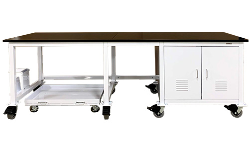 Vacuum Pump Enclosure from Mass Spectrometer Table integrated into Standard Mobile Tables. Freestanding mobile tray tucks under the workspace.